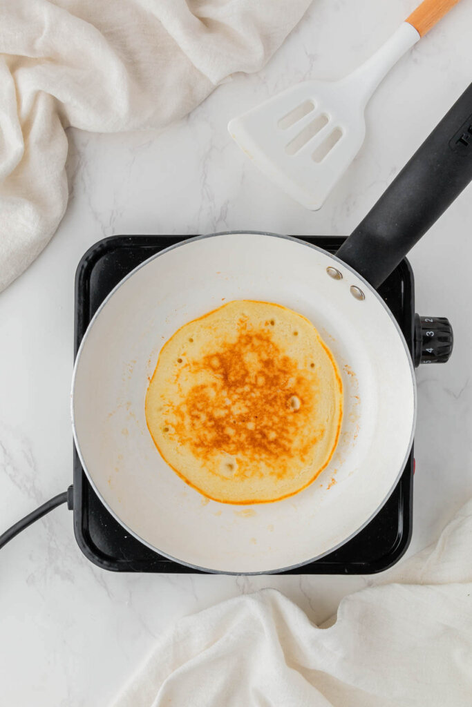 Golden brown pancake on a pan