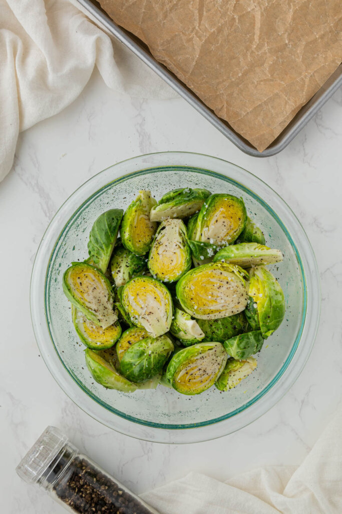 brussel sprouts halved in clear bowl 