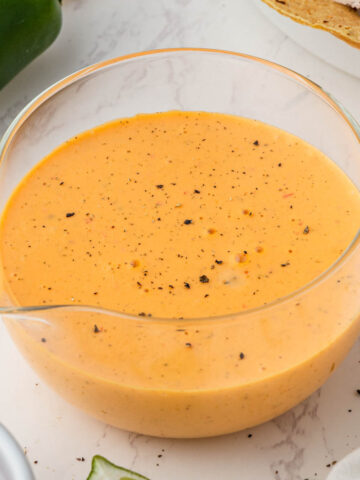 overhead view of Taco Bell Baja Sauce Recipe in glass serving bowl