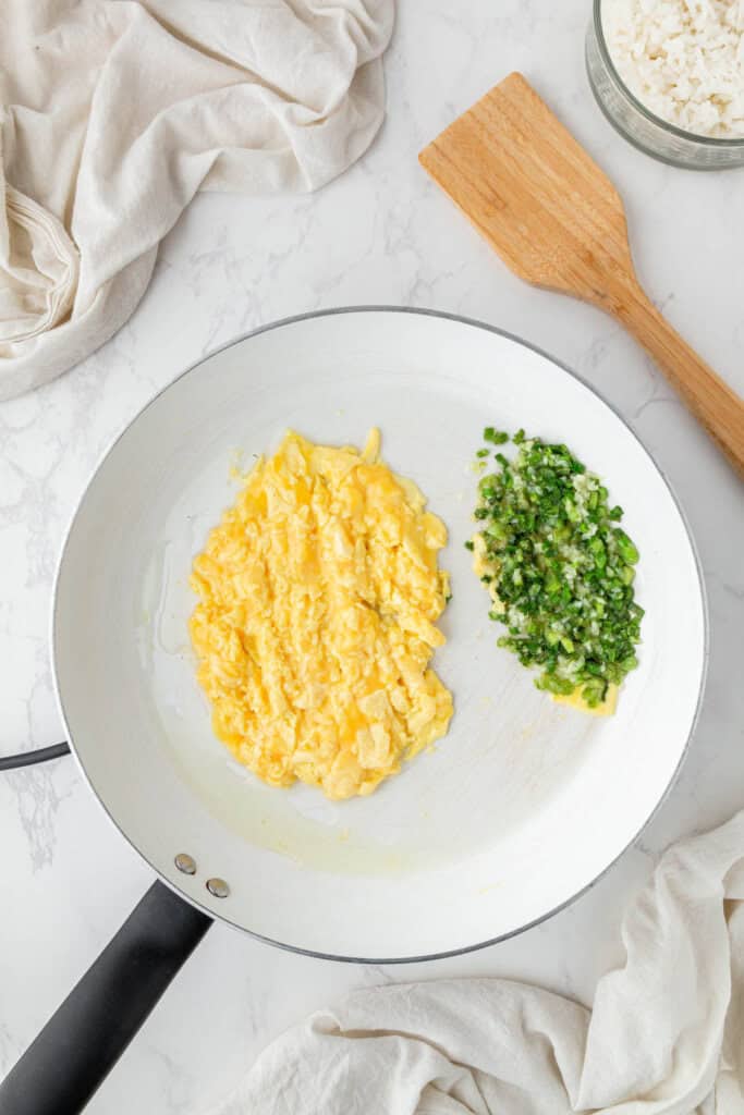 Vegetables and eggs unmixed in a pan