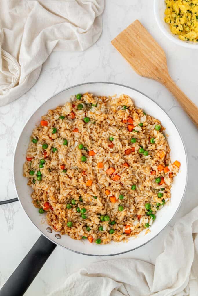 mixed pan of vegetables and rice now seasoned with oyster sauce