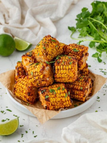 white serving bowl of wingstop corn with cilantro on top