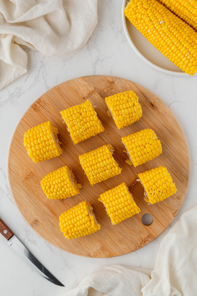 pieces of plain corn on wooden serving board