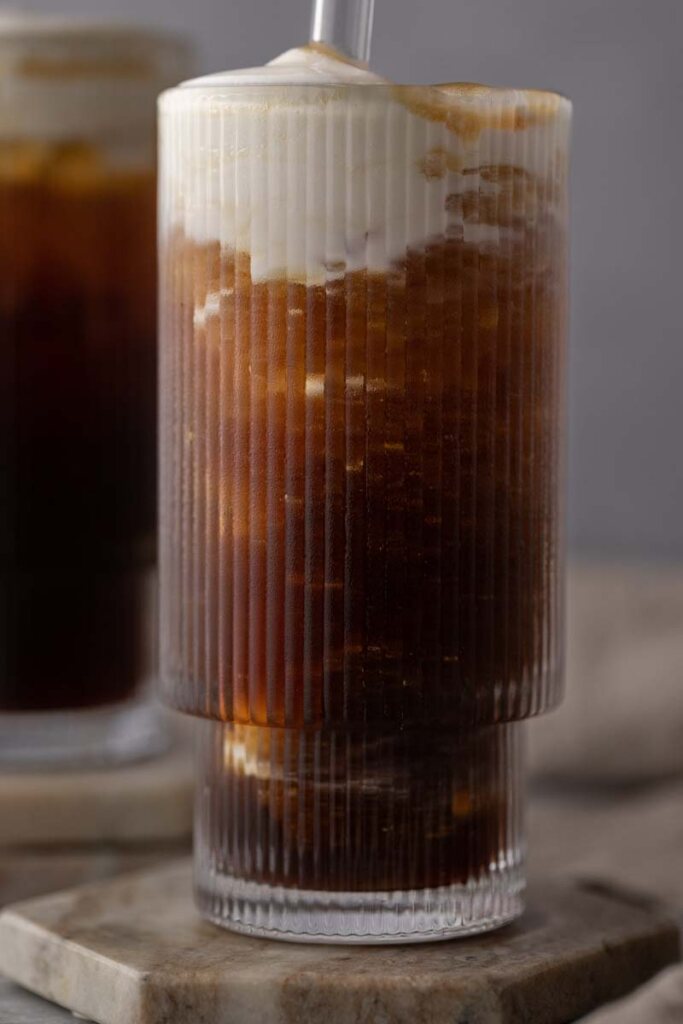 close up of Dutch Bros Soft Top iced coffee in rippled glass