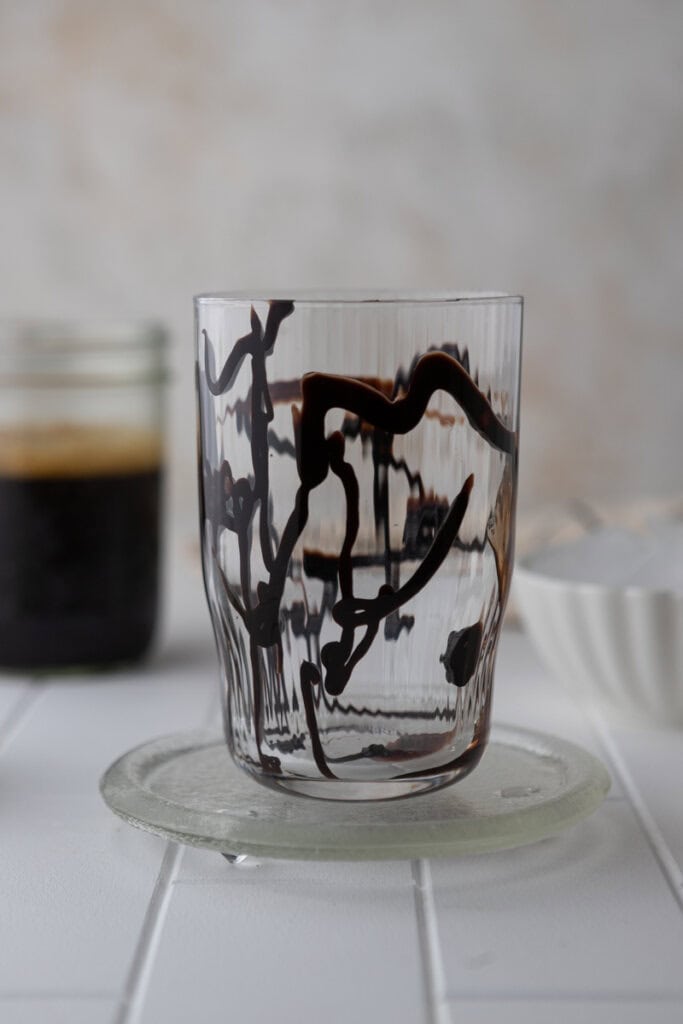 Chocolate syrup drizzled inside glass for Jack in the Box iced mocha