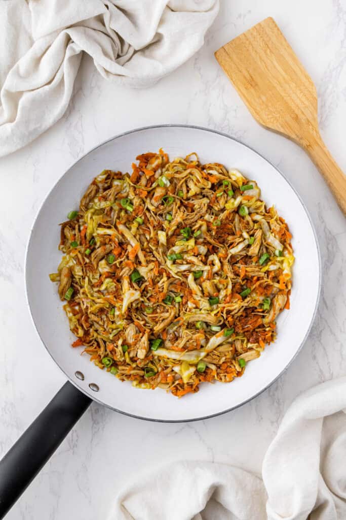overhead view of panda express chicken egg roll filling in pan