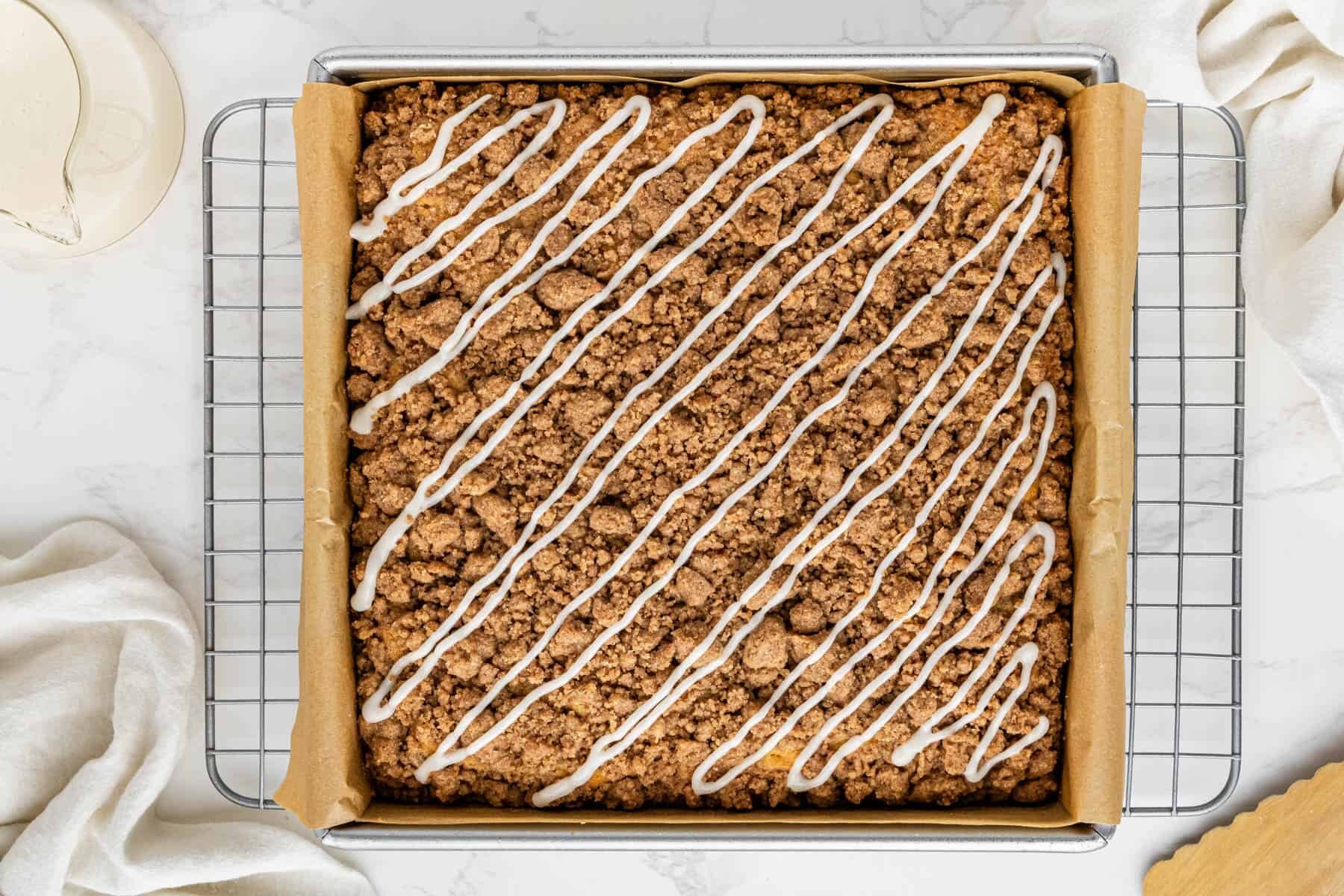 overhead view of copycat Starbucks Coffee Cake recipe with icing