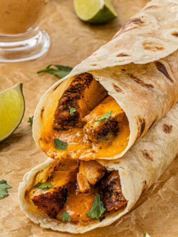 close up of chicken chipotle melts with sauce in the back