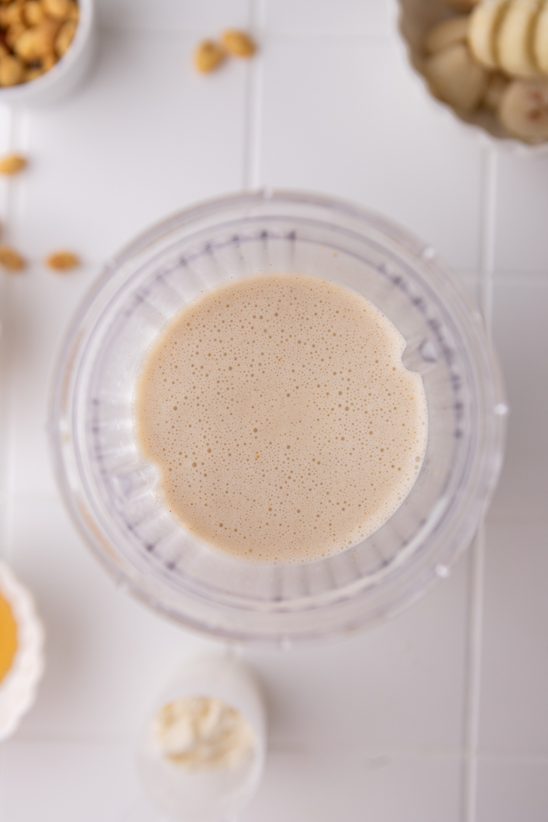 Blended peanut paradise smoothie in a blender cup