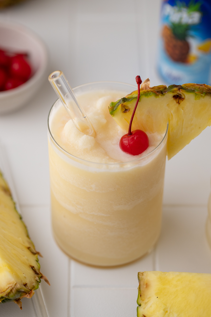topical Goya Pina colada with pineapple wedge and cherry