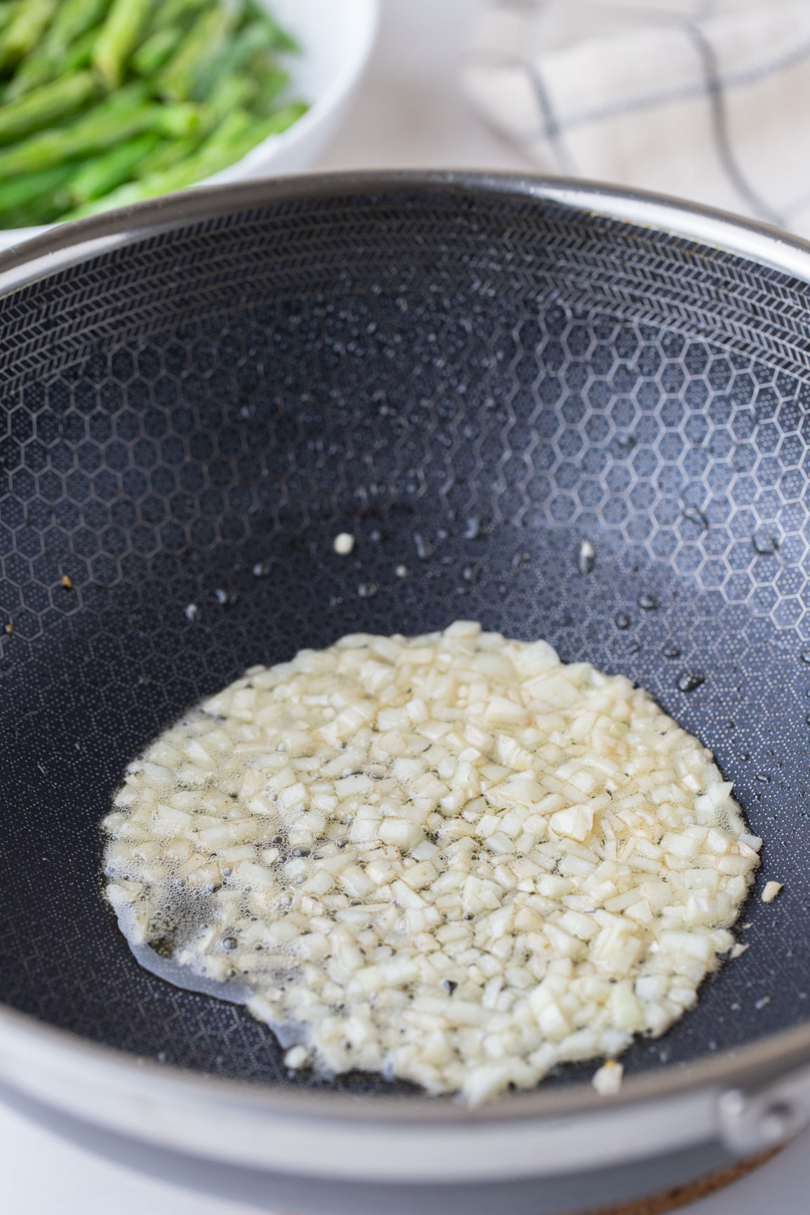 garlic sautéing in a pan