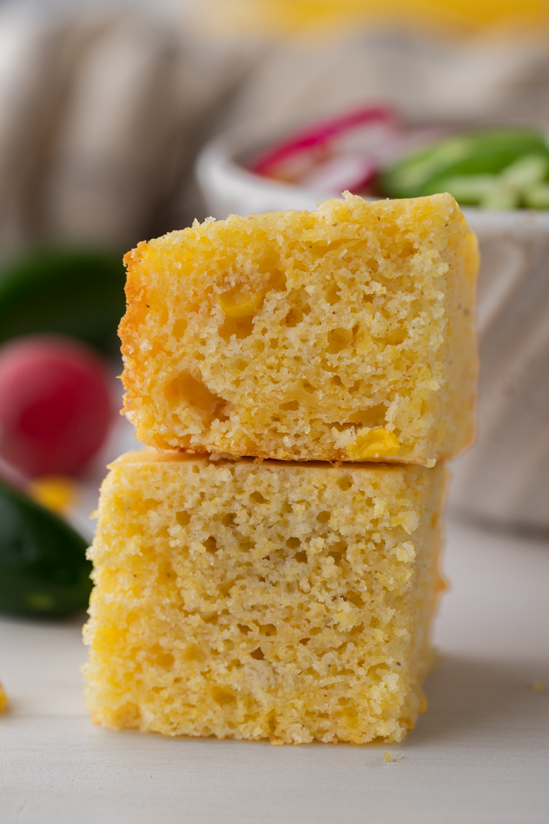 two squares from the krusteaz cornbread recipe stacked on top of each other