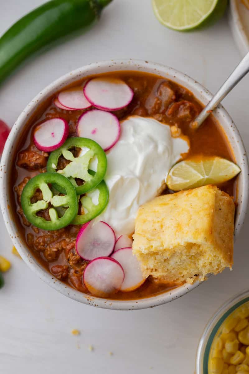a square of krusteaz cornbread recipe on top of a bowl of chili
