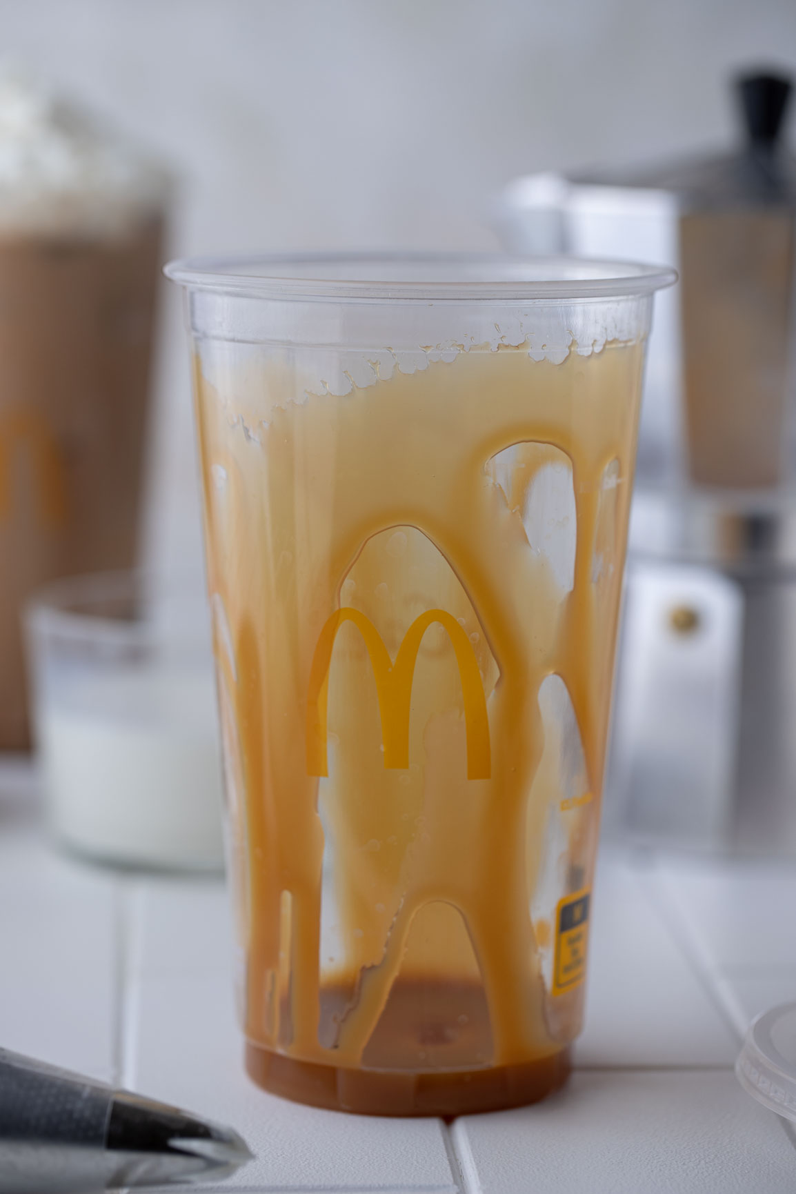 caramel sauce on the inside of the cup