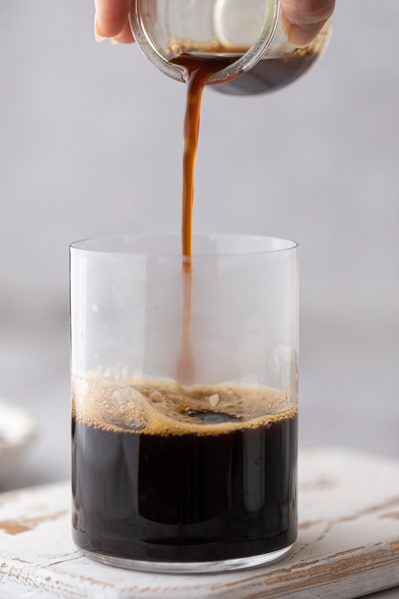 espresso being poured into a cup