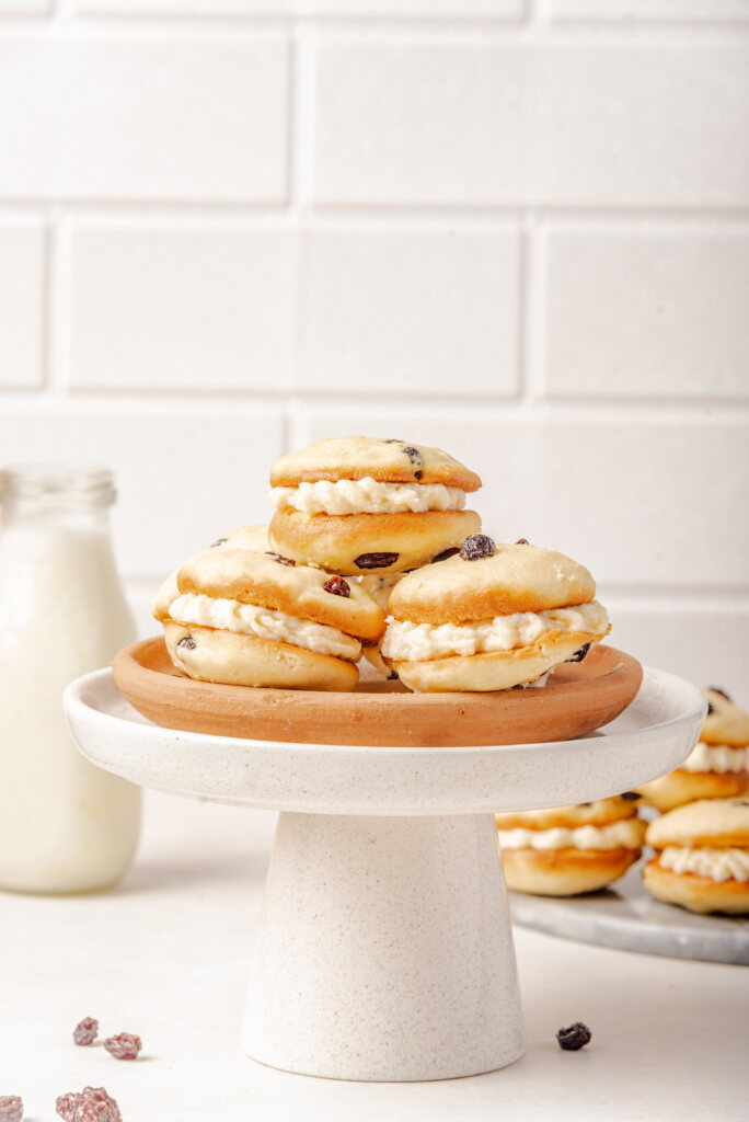 Little Debbie Raisin Cream Pies in a stack on a white cake stand