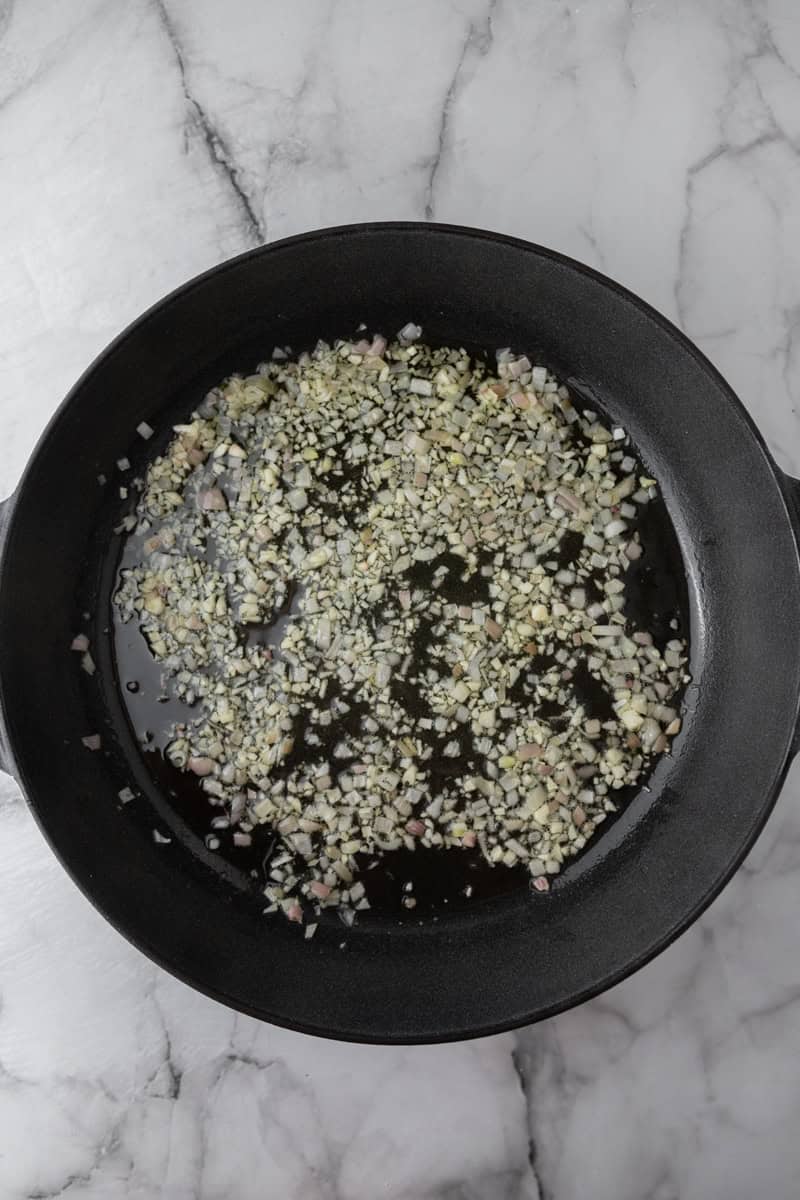 garlic and onion cooking in a pan
