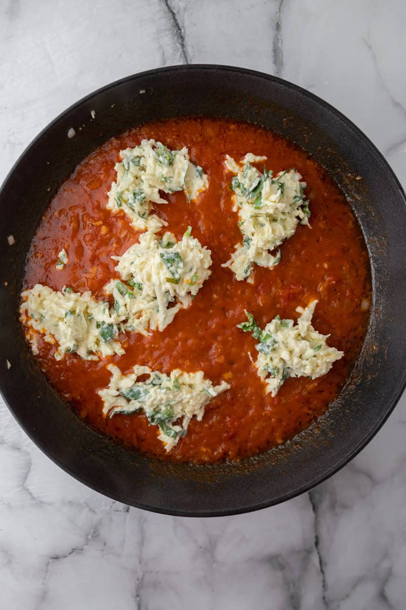 egg mixture being added to the sauce
