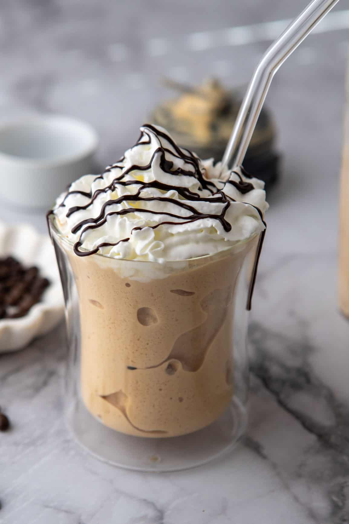 side shot of finished drink with a straw