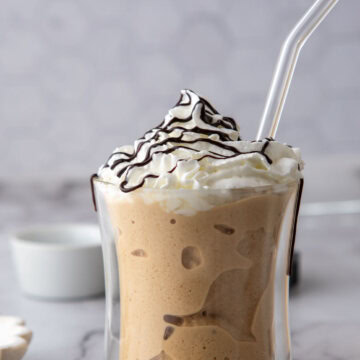 dunkin frozen coffee recipe in a glass with a straw