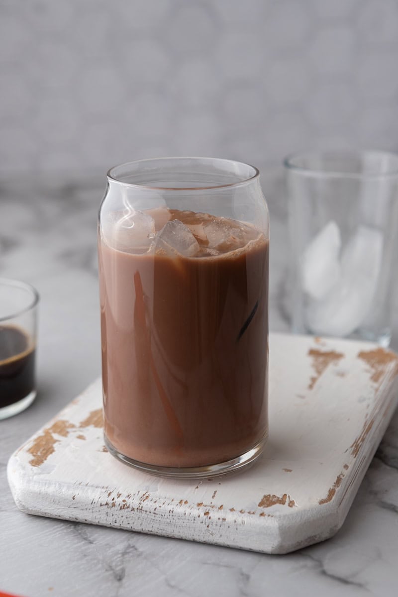 milk and caramel in a glass of ice