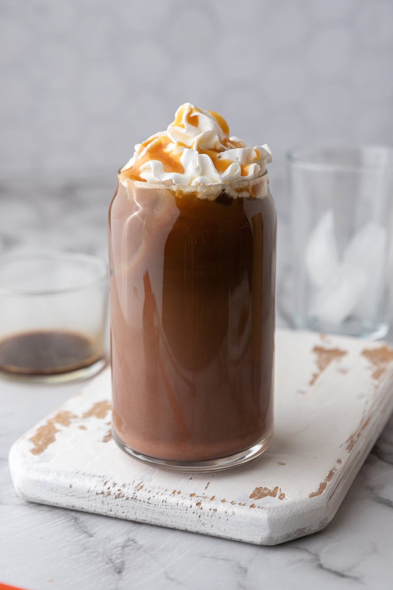 an iced coffee topped with whipped cream