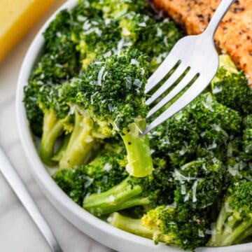 Longhorn Steakhouse Broccoli recipe with cheese with silver fork and salmon