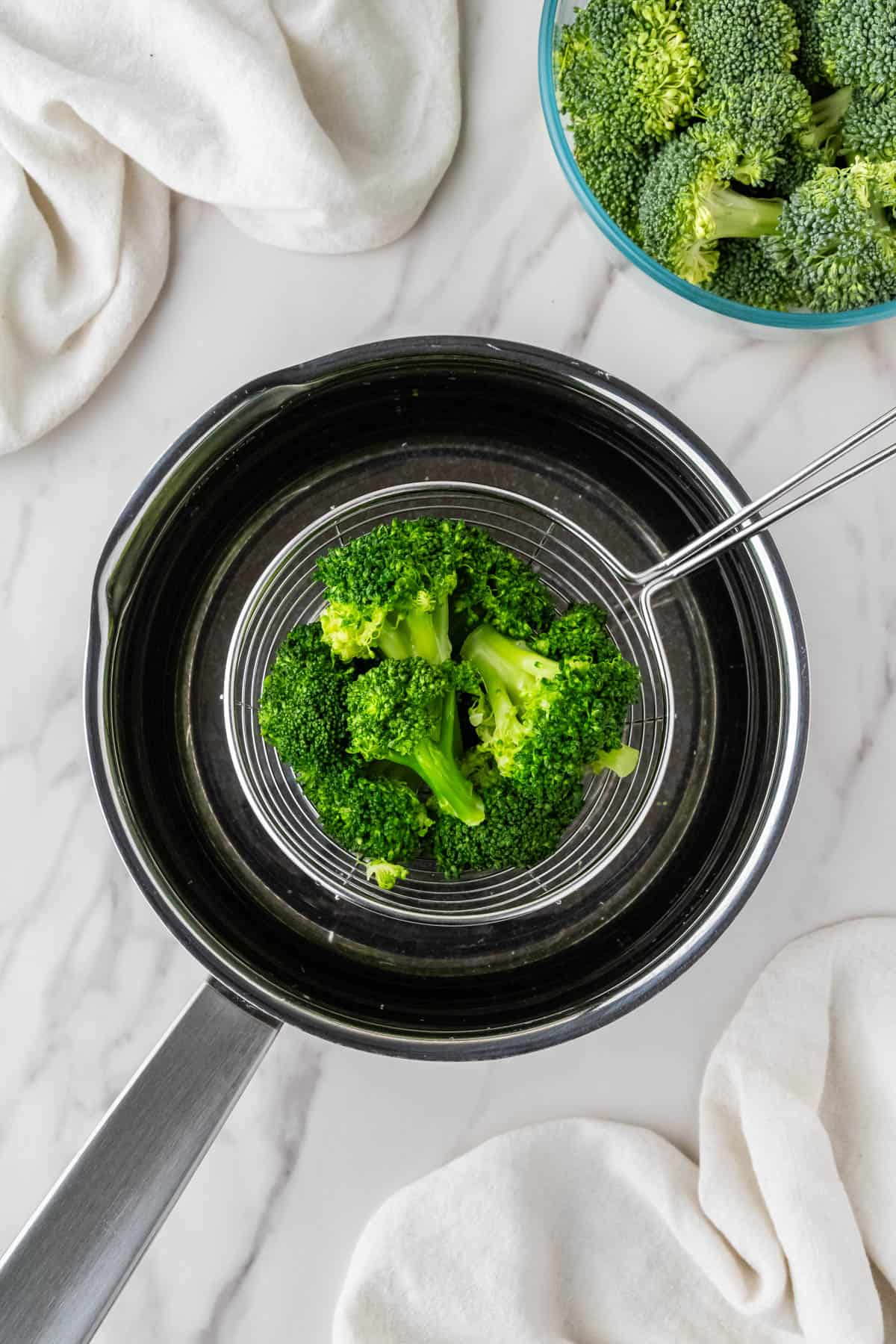 veggies getting taken out of saucepan