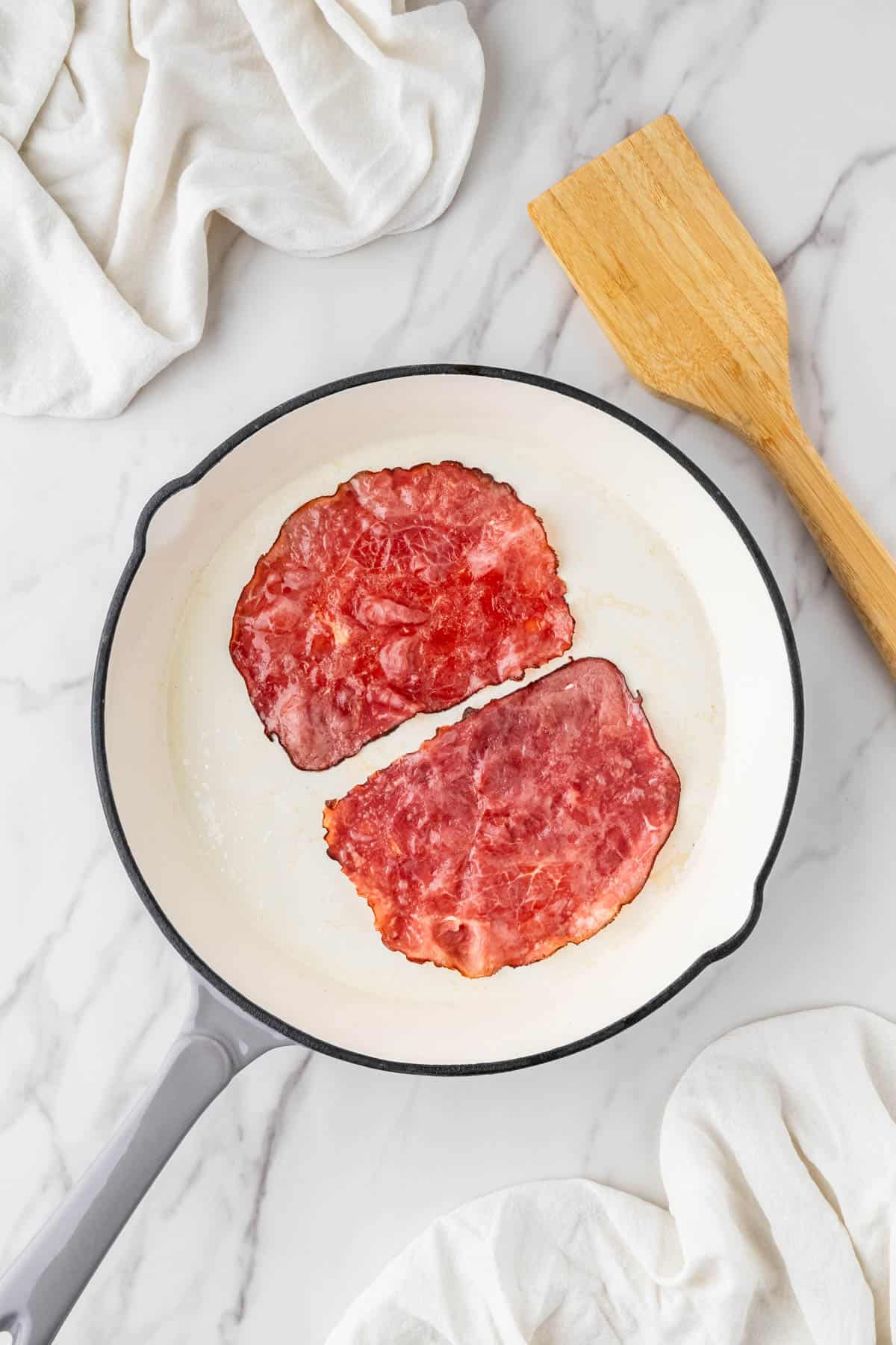 roast beef for the arby's beef and cheddar copycat recipe cooking in a pan