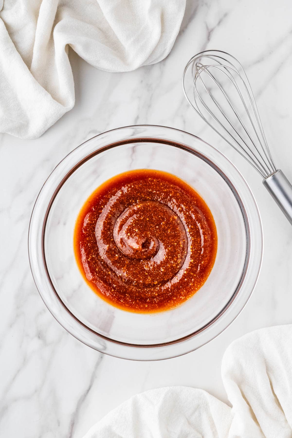 overhead view of sauce in clear bowl