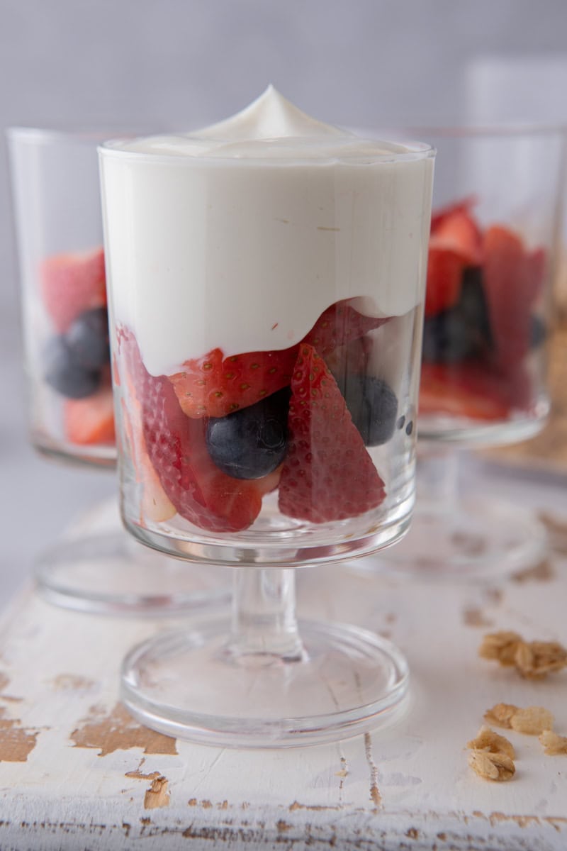 yogurt on top of fruit in a cup