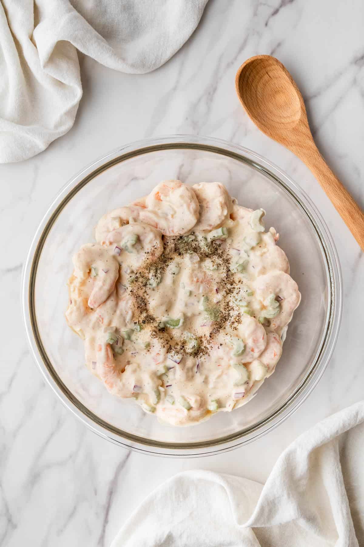 overhead view of mixed ingredients in clear bowl