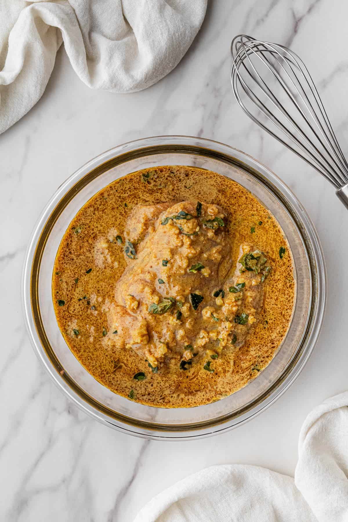 poultry sitting in marinade ingredients