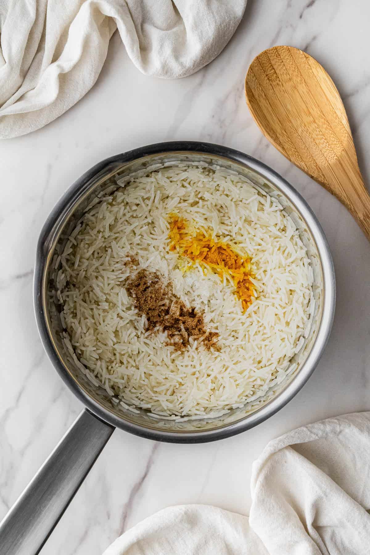 rice with seasonings in a pot