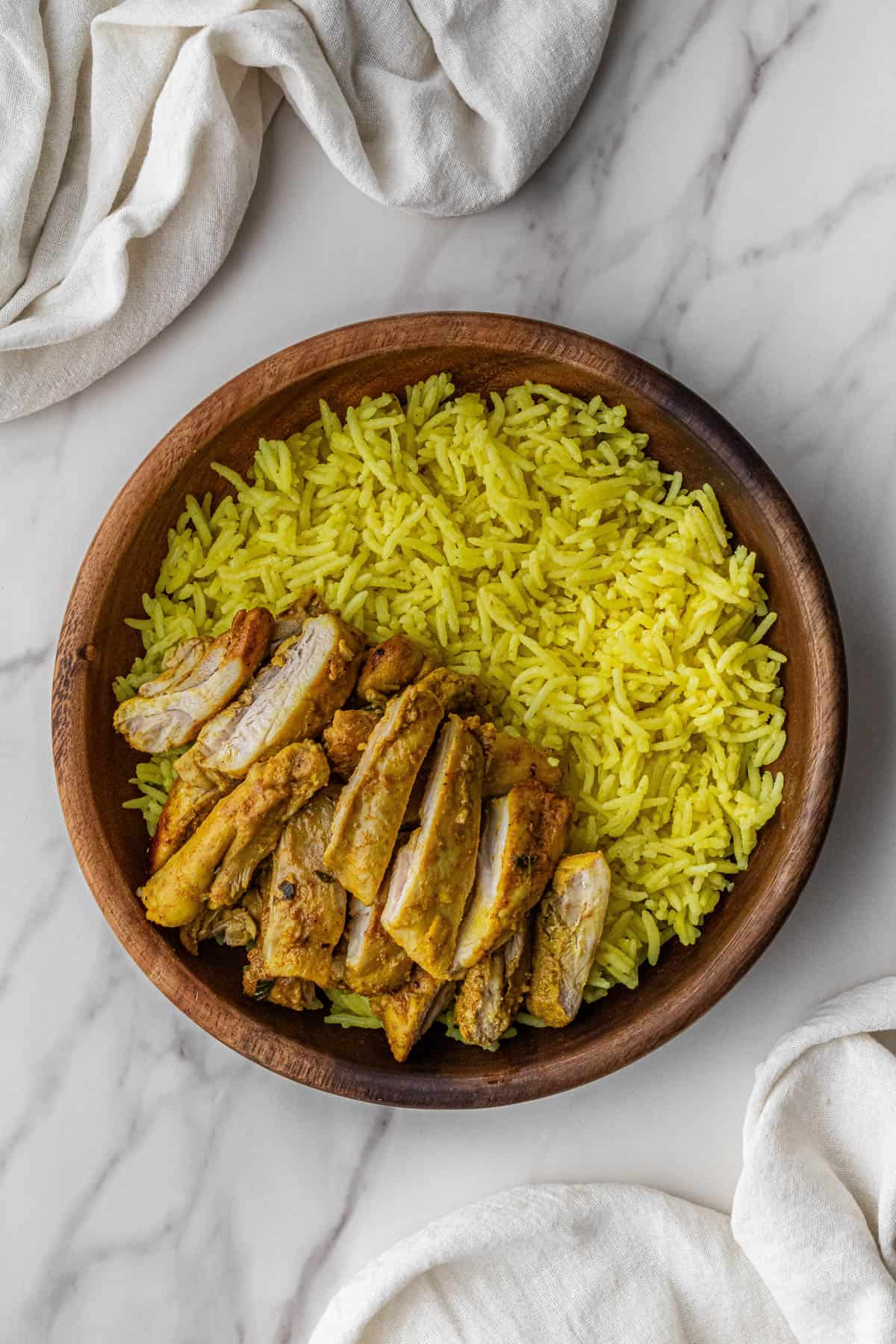 chicken over rice in a bowl
