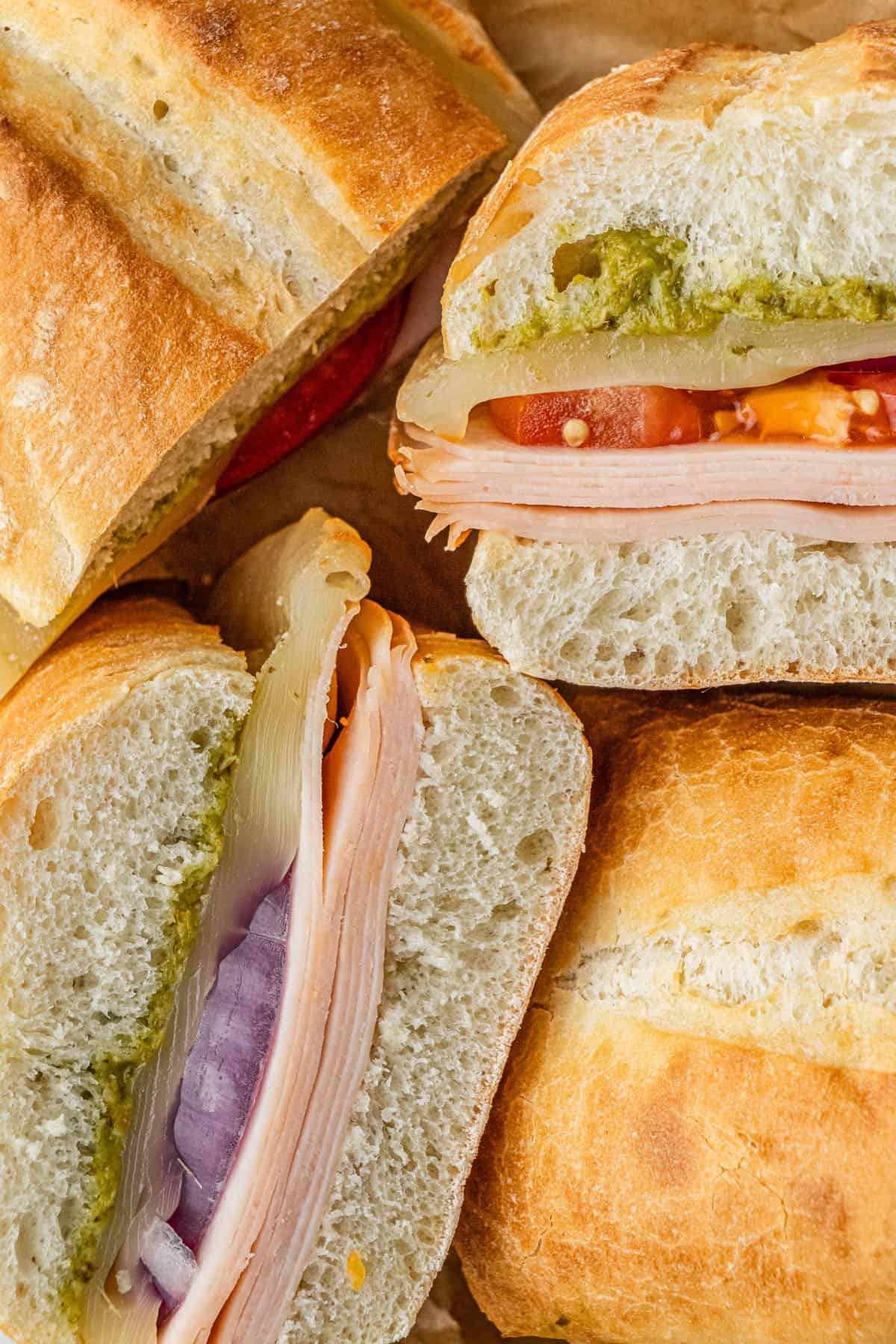 close up of pieces of Costco turkey and provolone sandwich