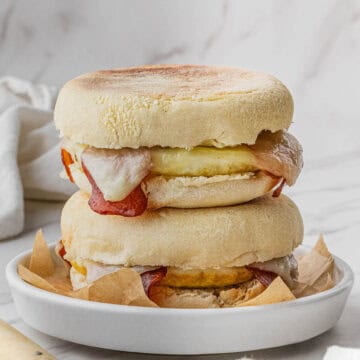 2 Starbucks Turkey Bacon Sandwich recipe stacked on top of each other on white plate