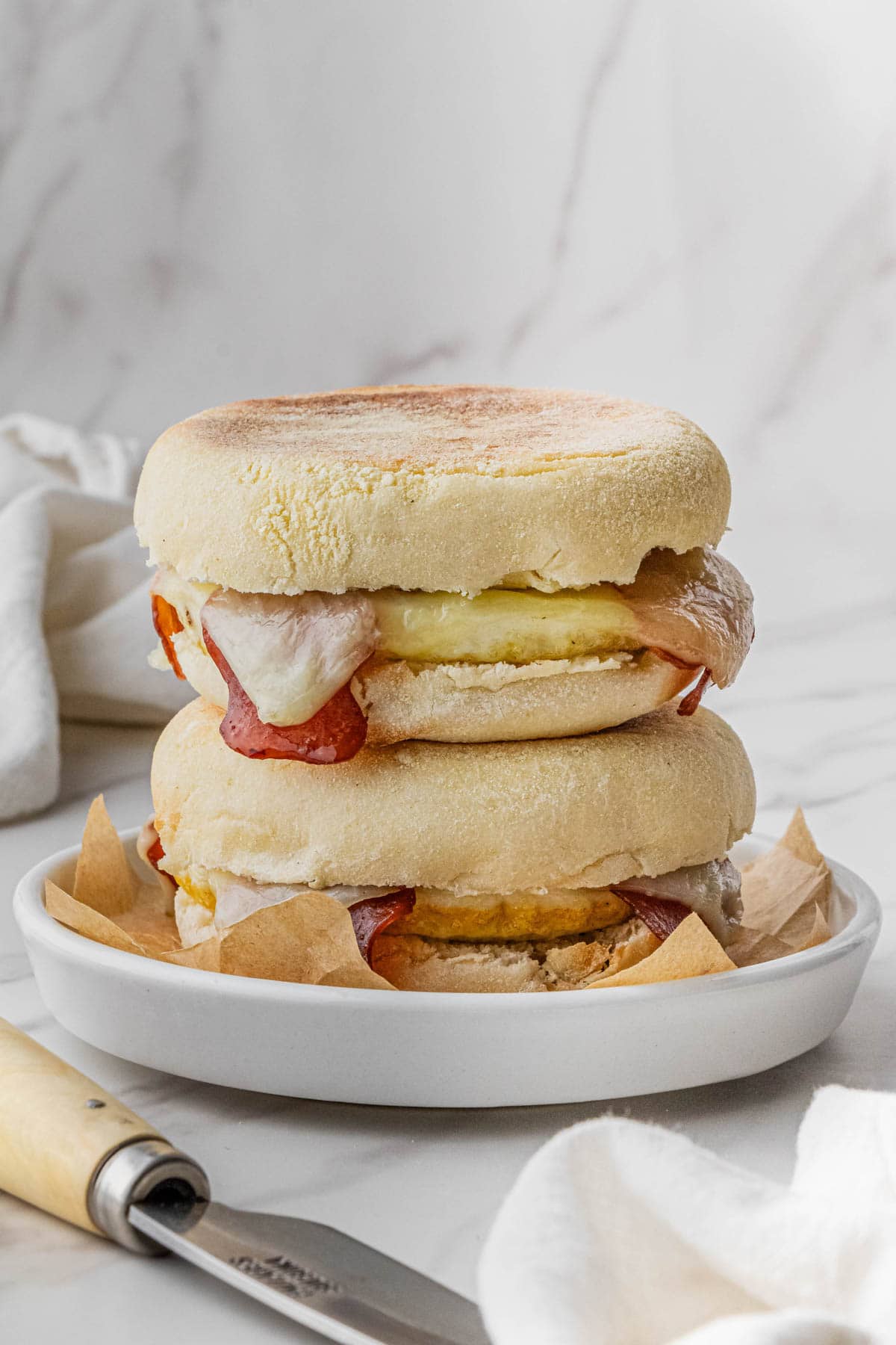 2 Starbucks Turkey Bacon Sandwich recipe stacked on top of each other on white plate