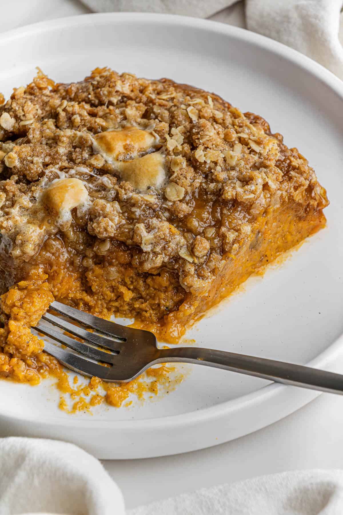 Boston Market Sweet Potato Casserole on white plate with fork