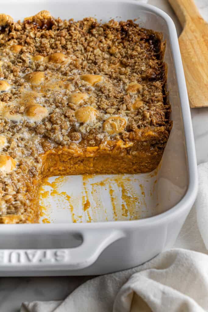 Boston Market Sweet Potato Casserole in casserole dish with one piece missing