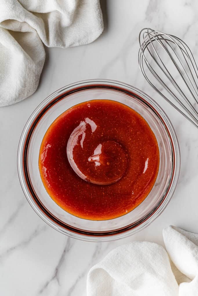 ketchup glaze in mixing bowl with whisk on side