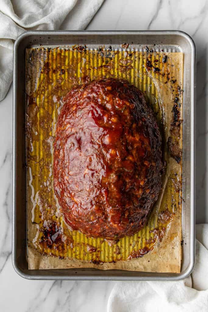 Cracker Barrel Meatloaf recipe with ketchup glaze on baking sheet