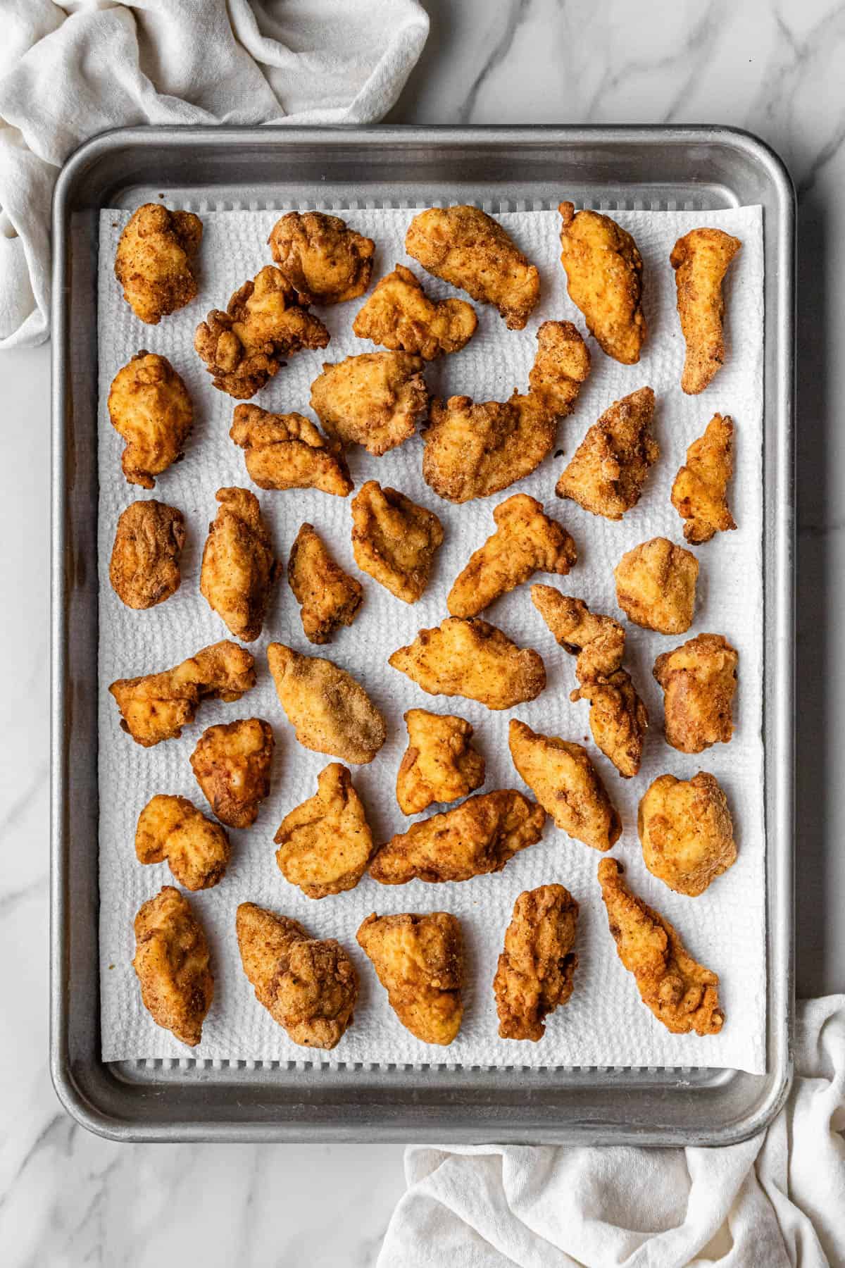 Chick-Fil-A Chicken Nuggets copycat recipe cooling on baking sheet