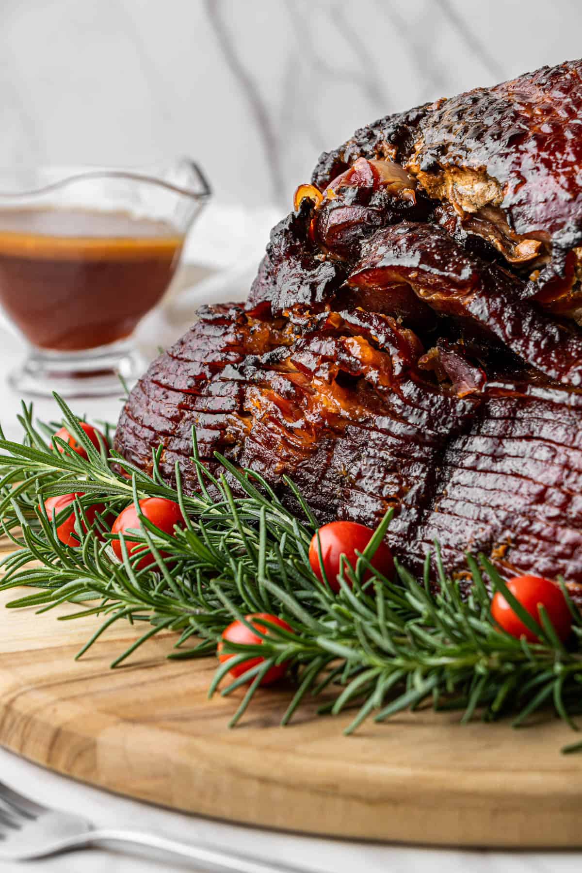 Honey Baked Ham company copycat recipe on greenery and tomato garnish