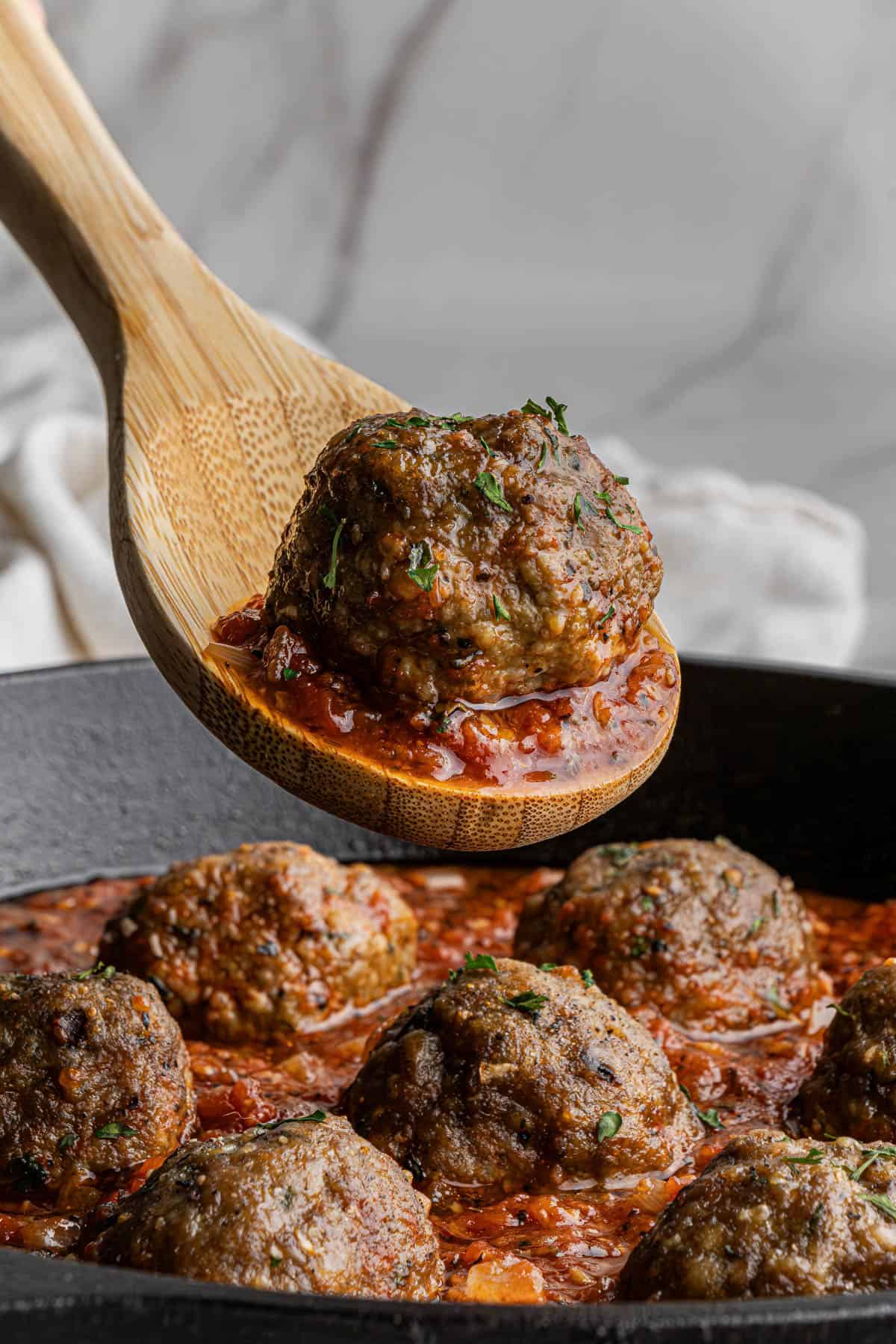 olive garden meatballs recipe in a skillet with tomato sauce