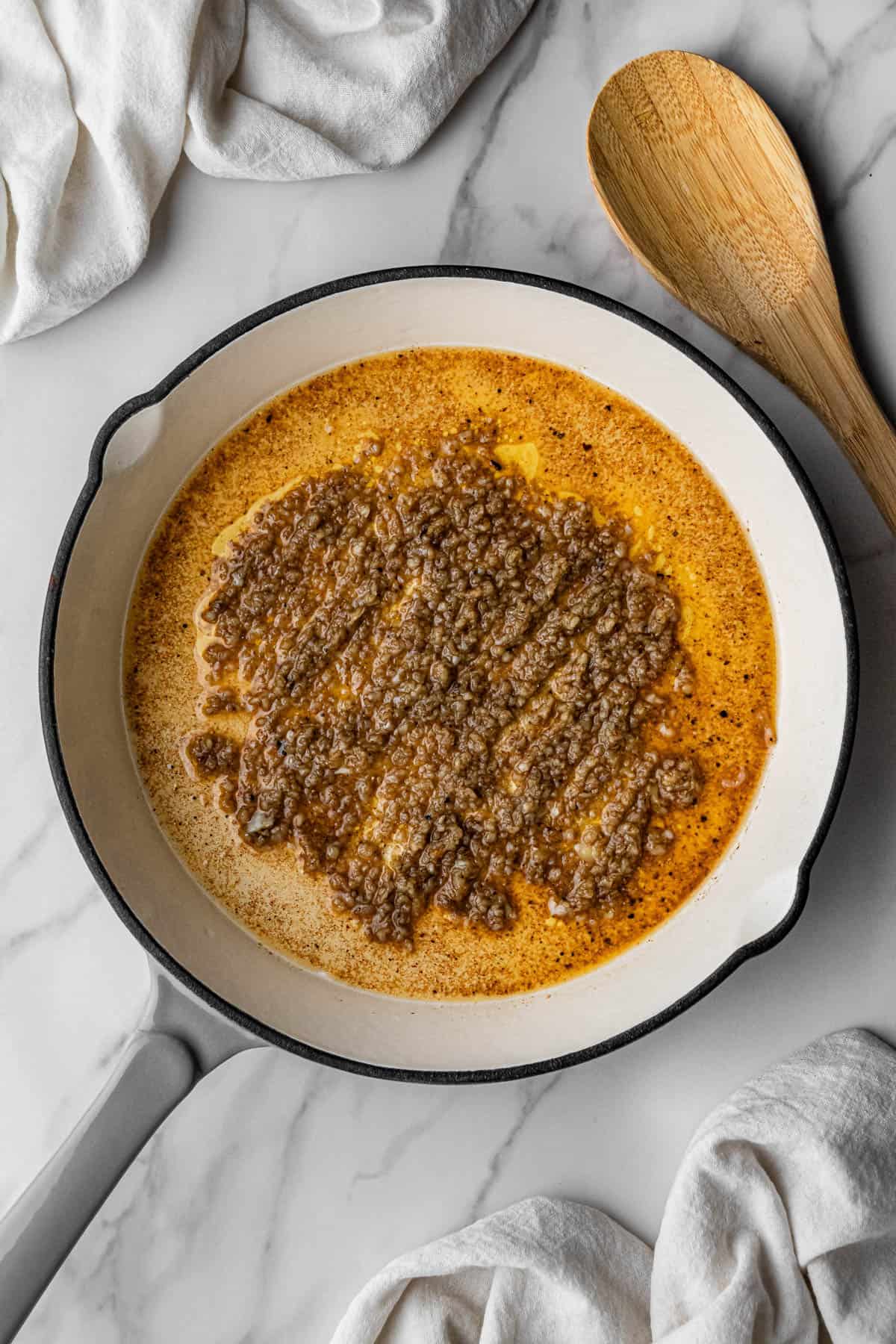 skillet with garlic bits