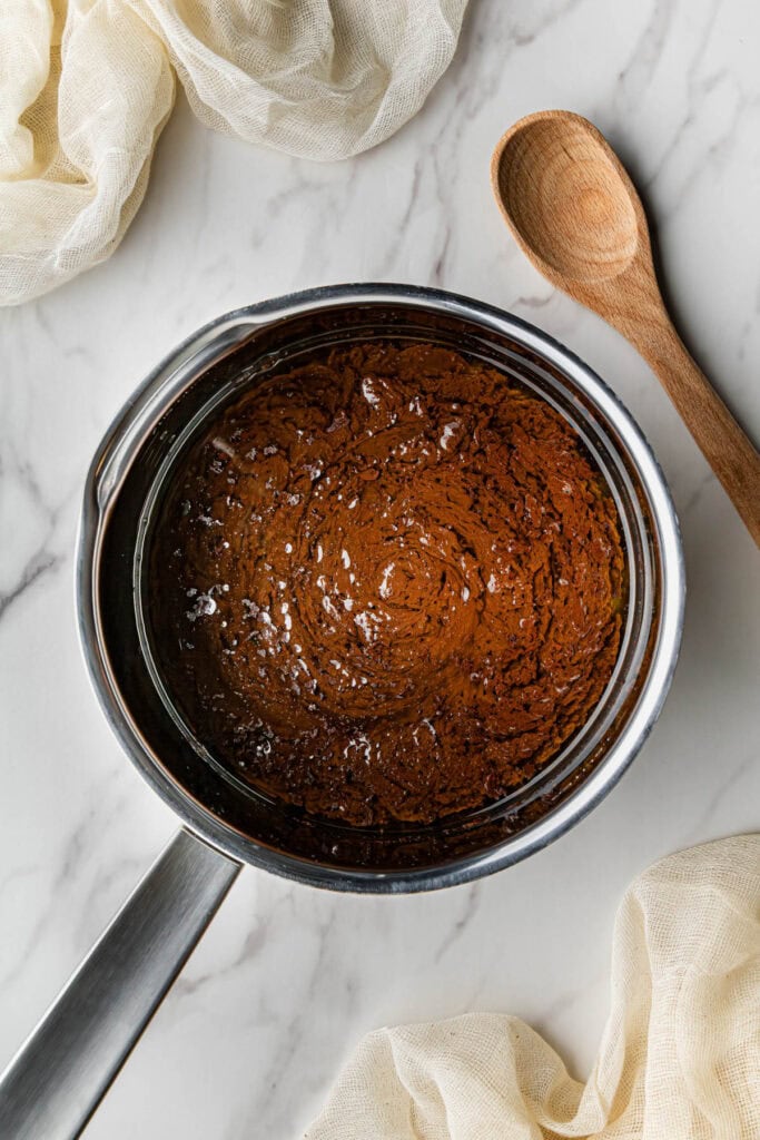 Flat lay shot of a saucepan with butter and Coke mixture in it.
