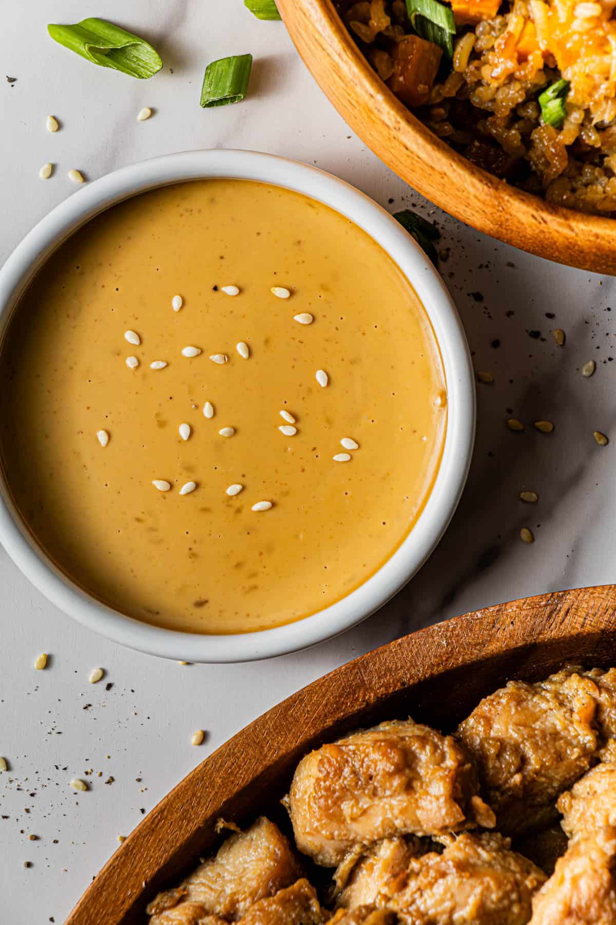 Flat lay shot of a white bowl with Benihana Magic Mustard sauce.