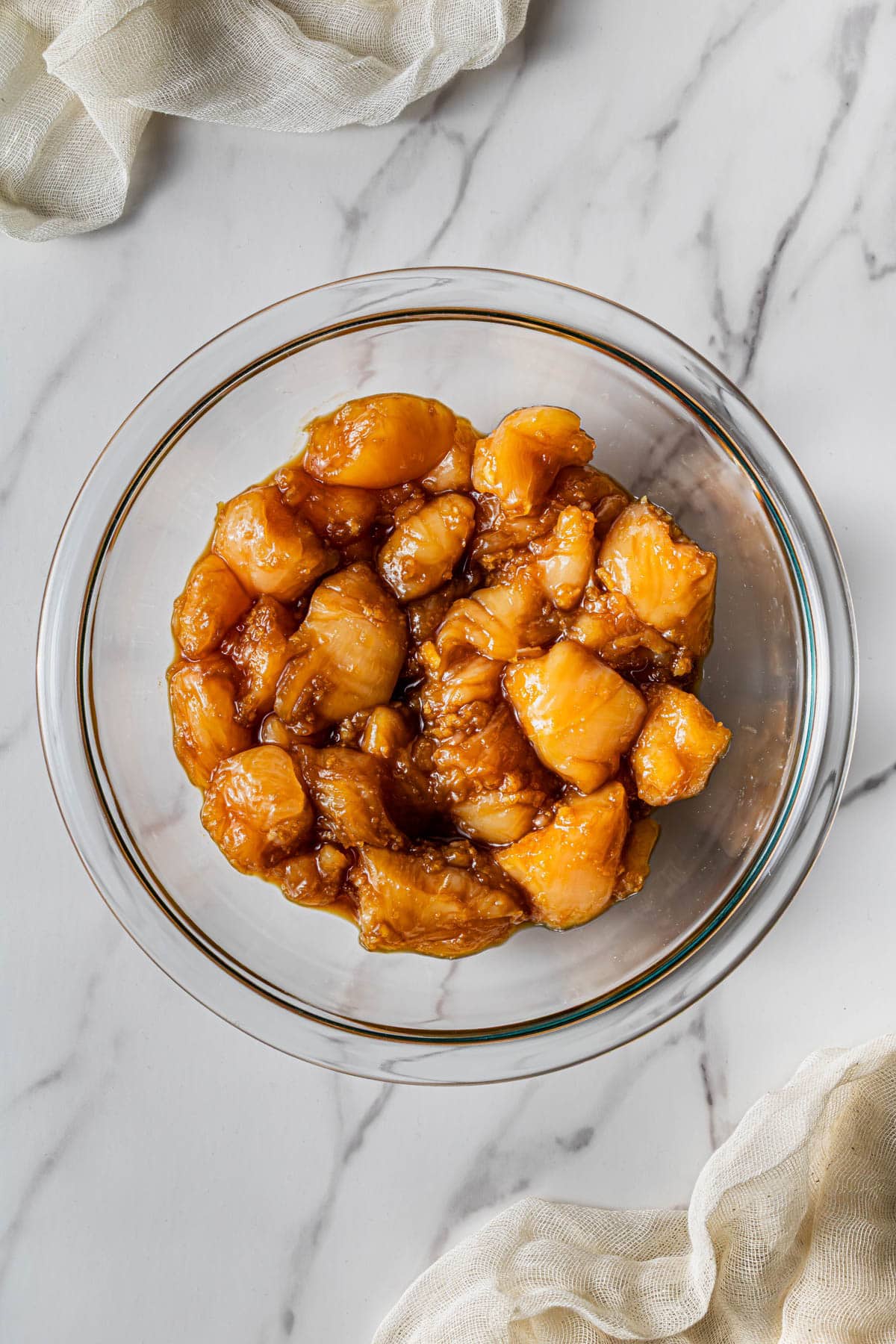 ingredients being marinated in a bowl