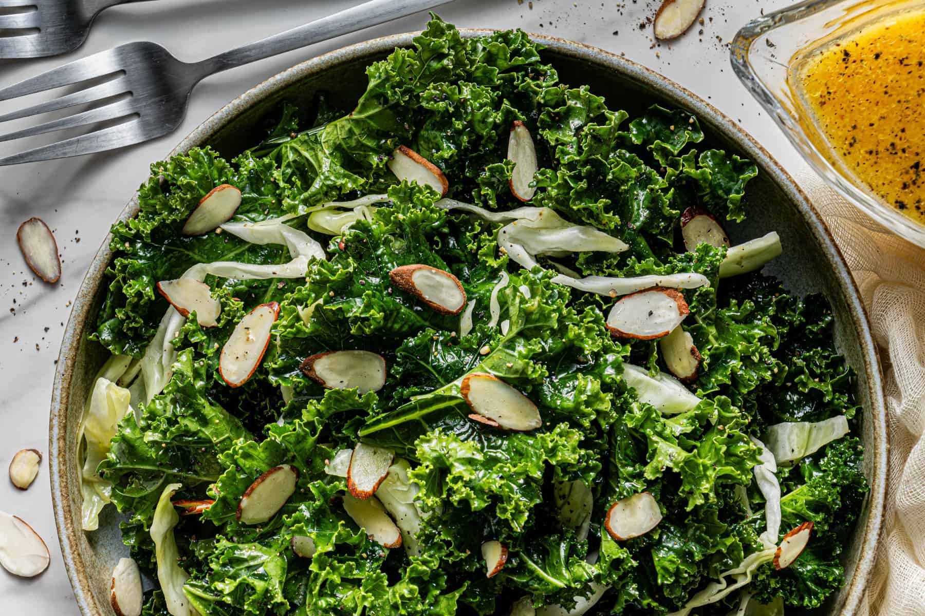 Flat lay shot of a wooden bowl with chick fil a Kale Crunch Salad in it.